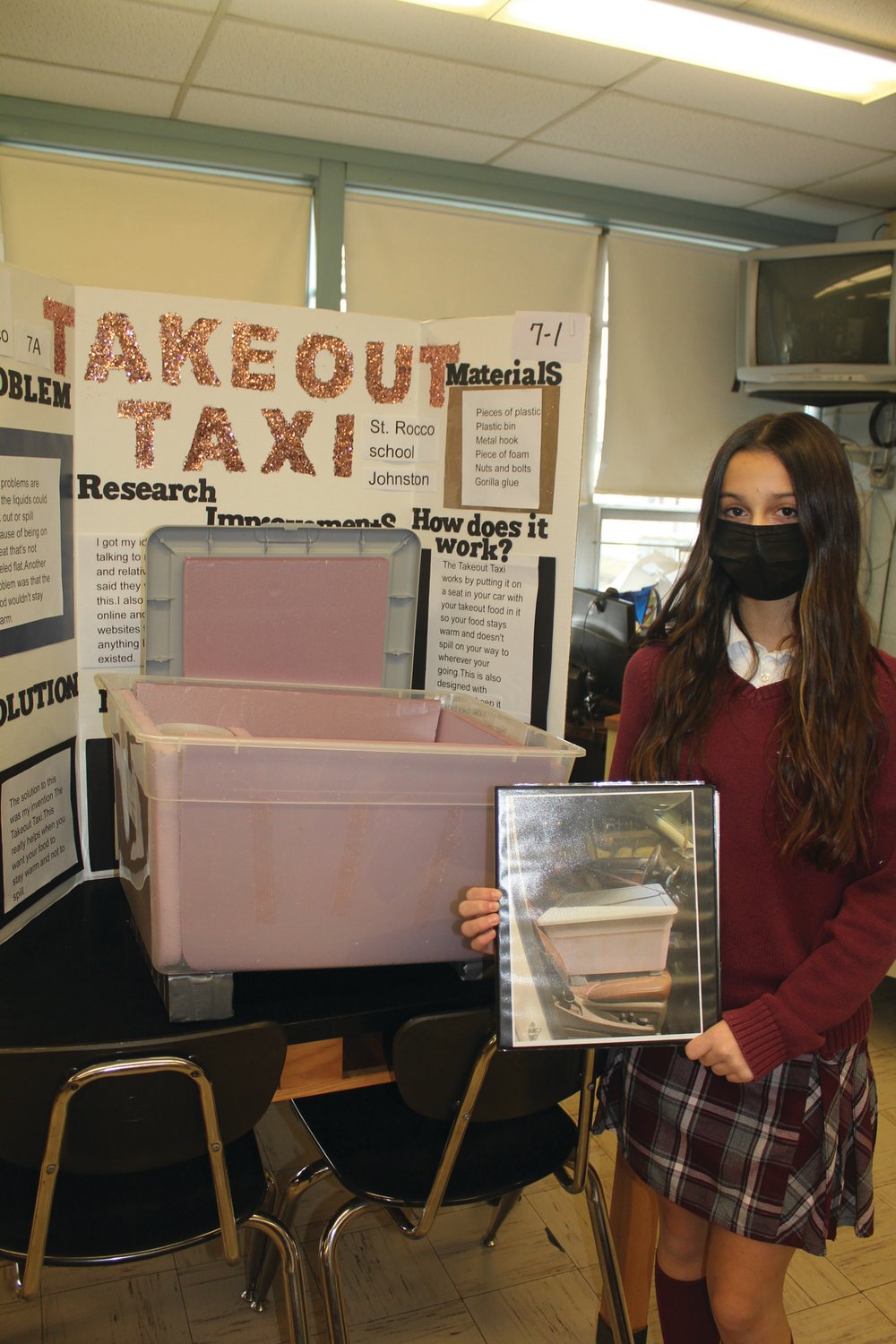 INVENTION CONVENTION: Saint Rocco School student Jolie Caparco shows off her invention at the Annual Invention Convention. (Photo courtesy Robin Okolowitcz)